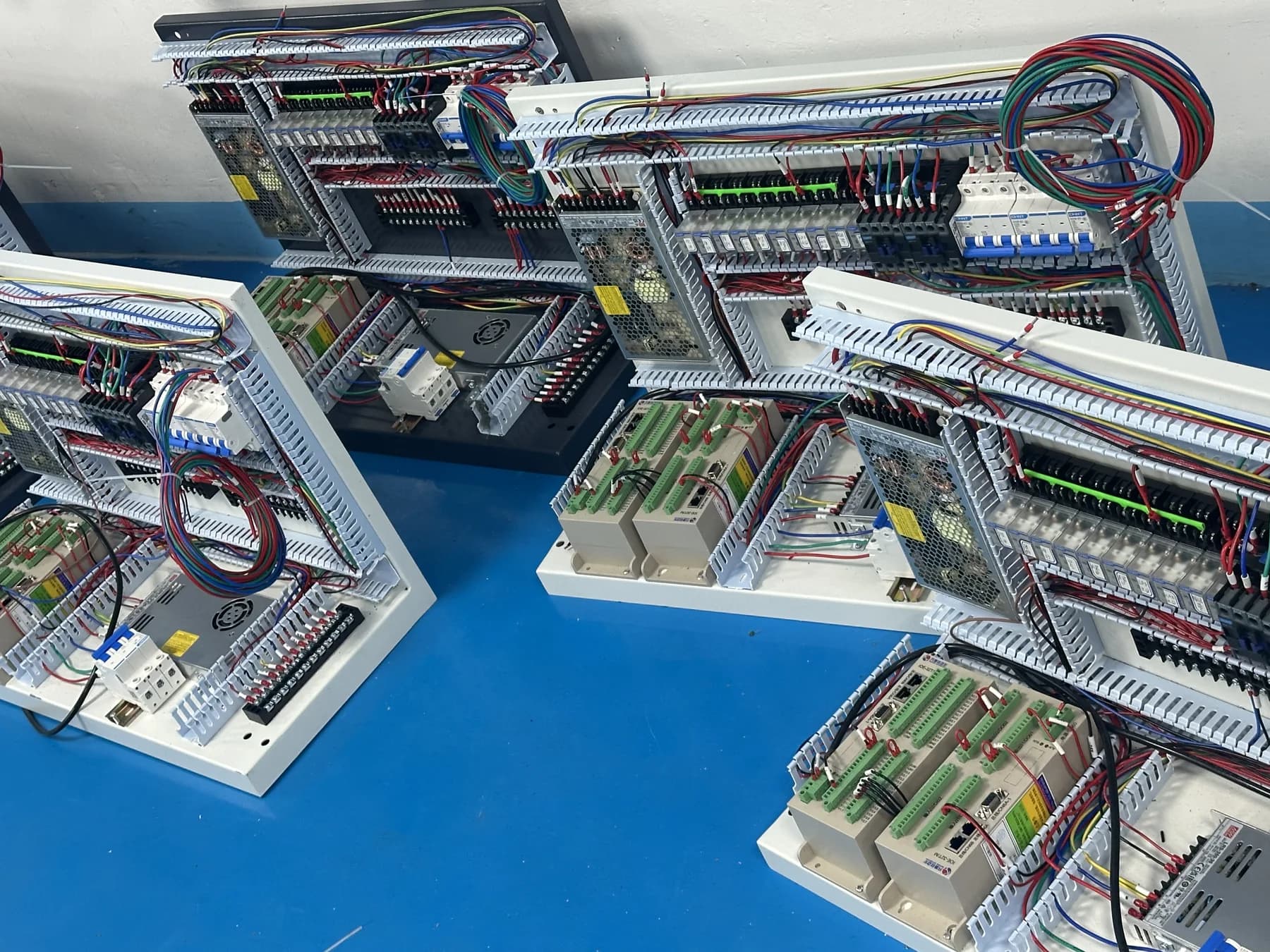 Electrical control assemblies under construction on the factory floor